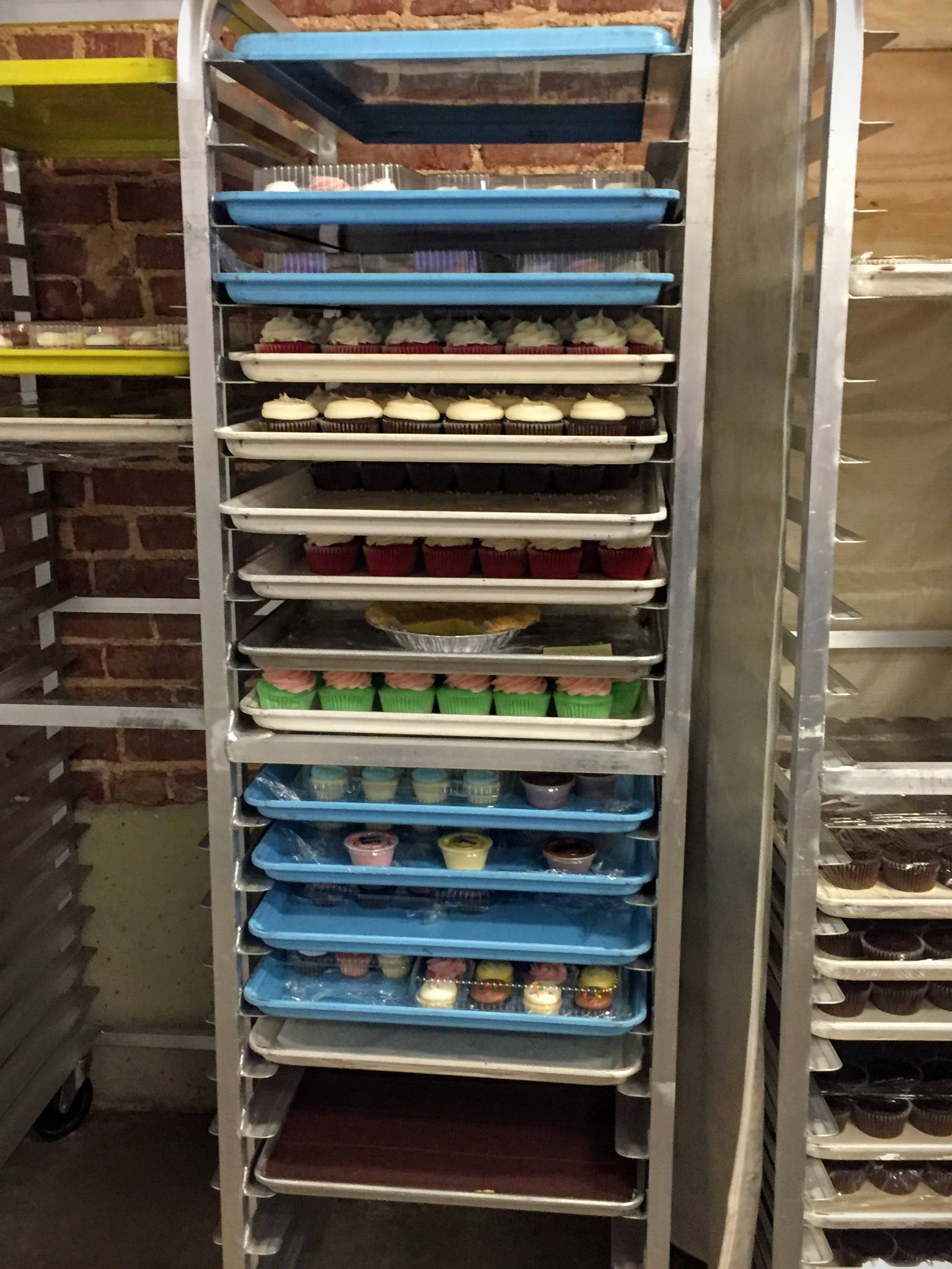 We walked by the huge walk-in freezer and then by these trays of cupcakes. The color of the tray signifies the Muddy's location where the cupcakes will end up! 